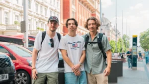 Three young men standing on a London street representing the next generation.