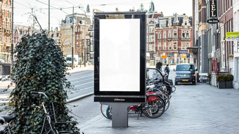 A digital advertising board on a city street with a blank display, representing new advertising opportunities for local businesses.
