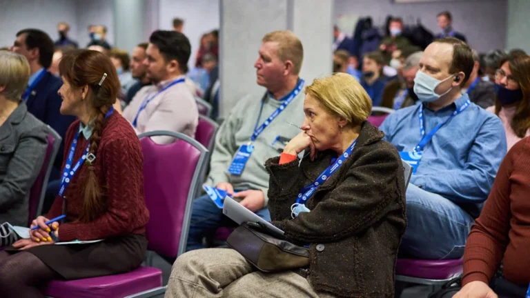 Attendees at a regional health conference in Lithuania participating in sessions regarding nursing policy updates.