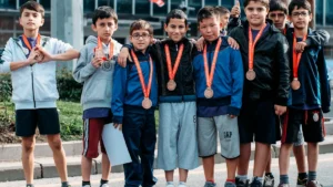 Young athletes wearing medals during a ceremony in Vilnius, Lithuania.
