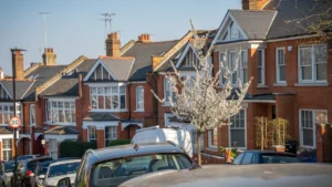 A row of red brick residential houses on a street in Northamptonshire.