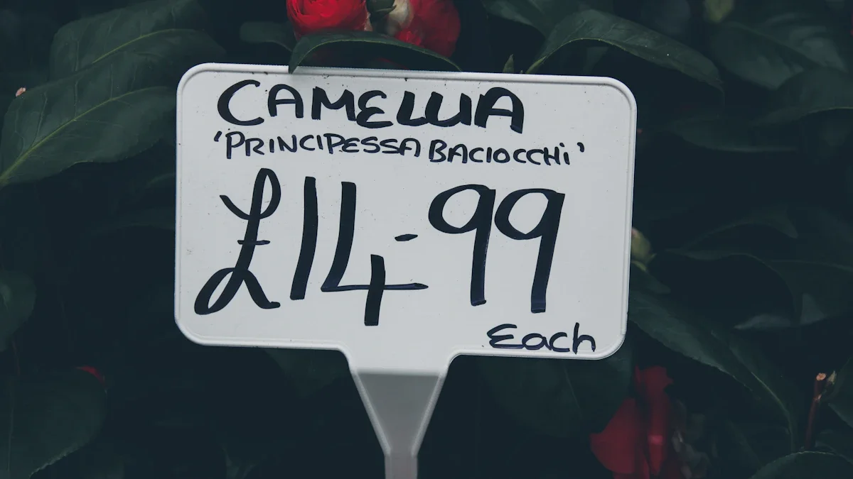 A close-up of a white retail price tag displaying fourteen pounds and ninety-nine pence in British currency.