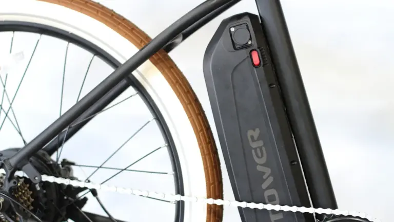 Close-up of a black e-bike battery mounted on a bicycle frame.