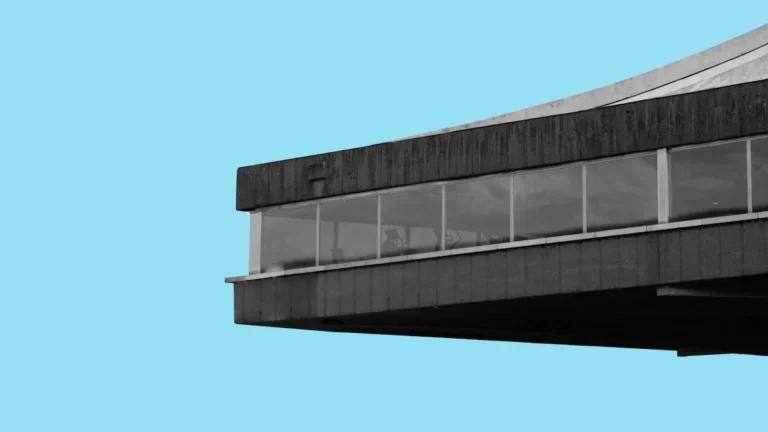 The iconic cantilevered roofline of the Vilnius Palace of Concerts and Sports, a Brutalist landmark in Lithuania.