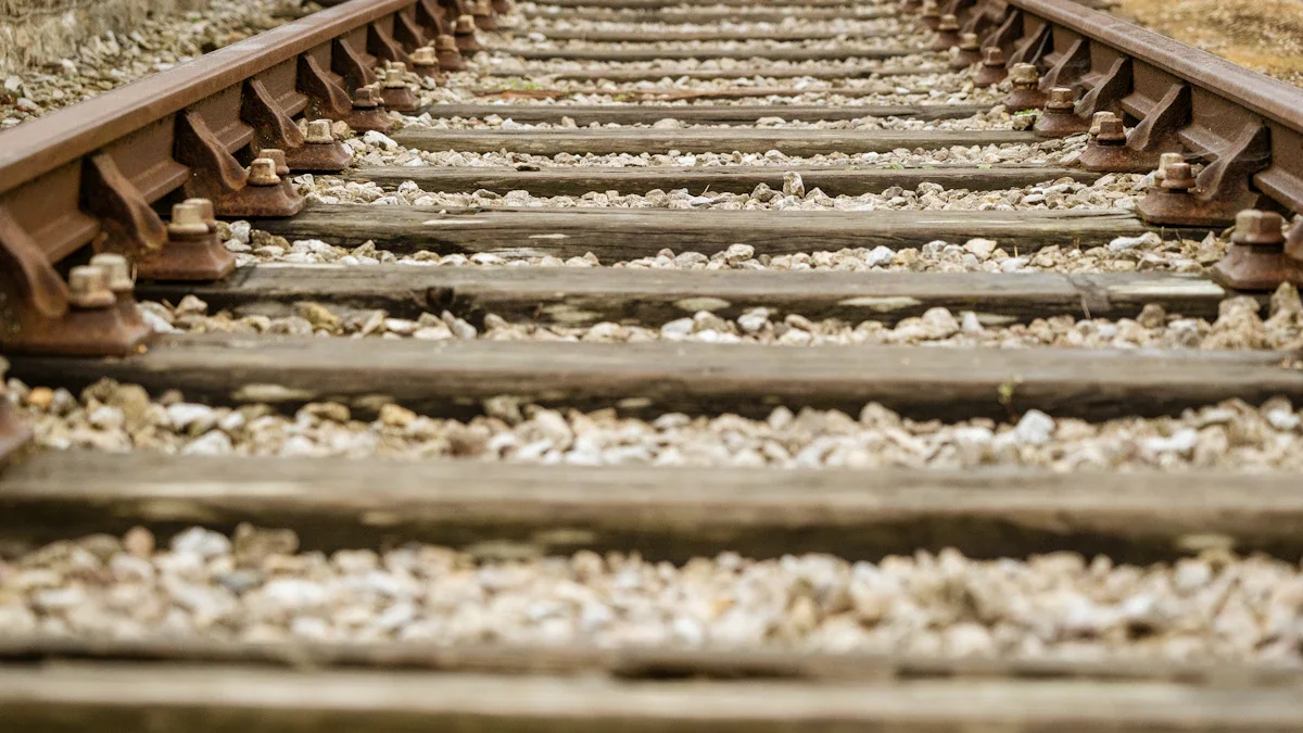 Low level view of railway tracks and gravel at a station in Bournemouth, UK.