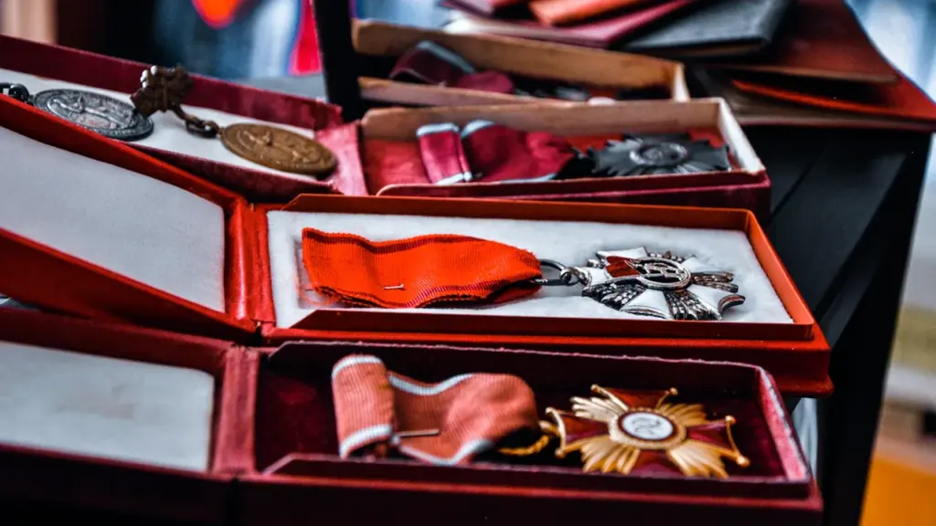 Collection of award medals presented in elegant red velvet display boxes