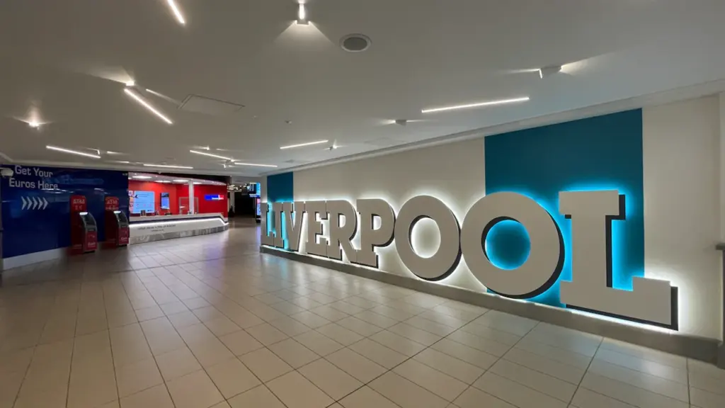 Modern interior lobby with a large Liverpool sign in a community facility.