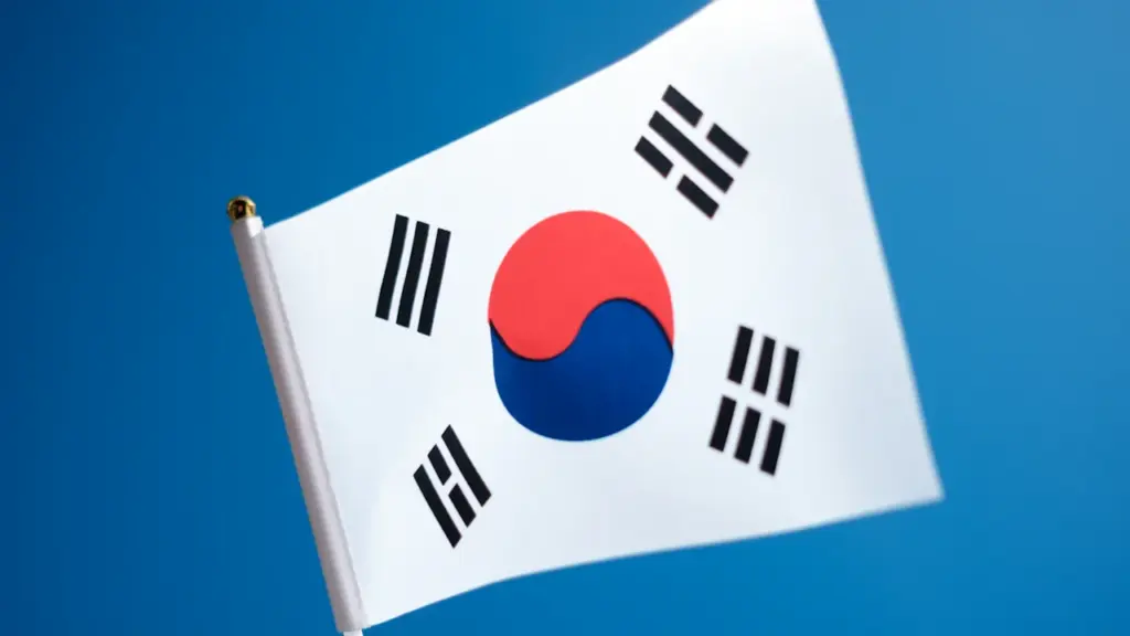 South Korean flag waving against a clear blue sky on a bright day
