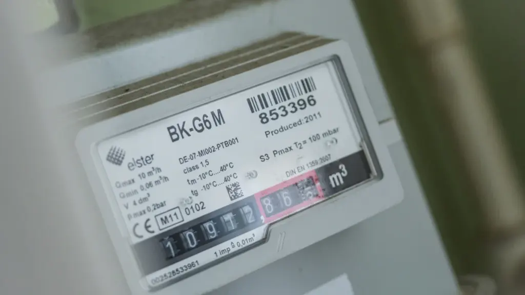 Close-up of a residential gas meter tracking household energy consumption levels.